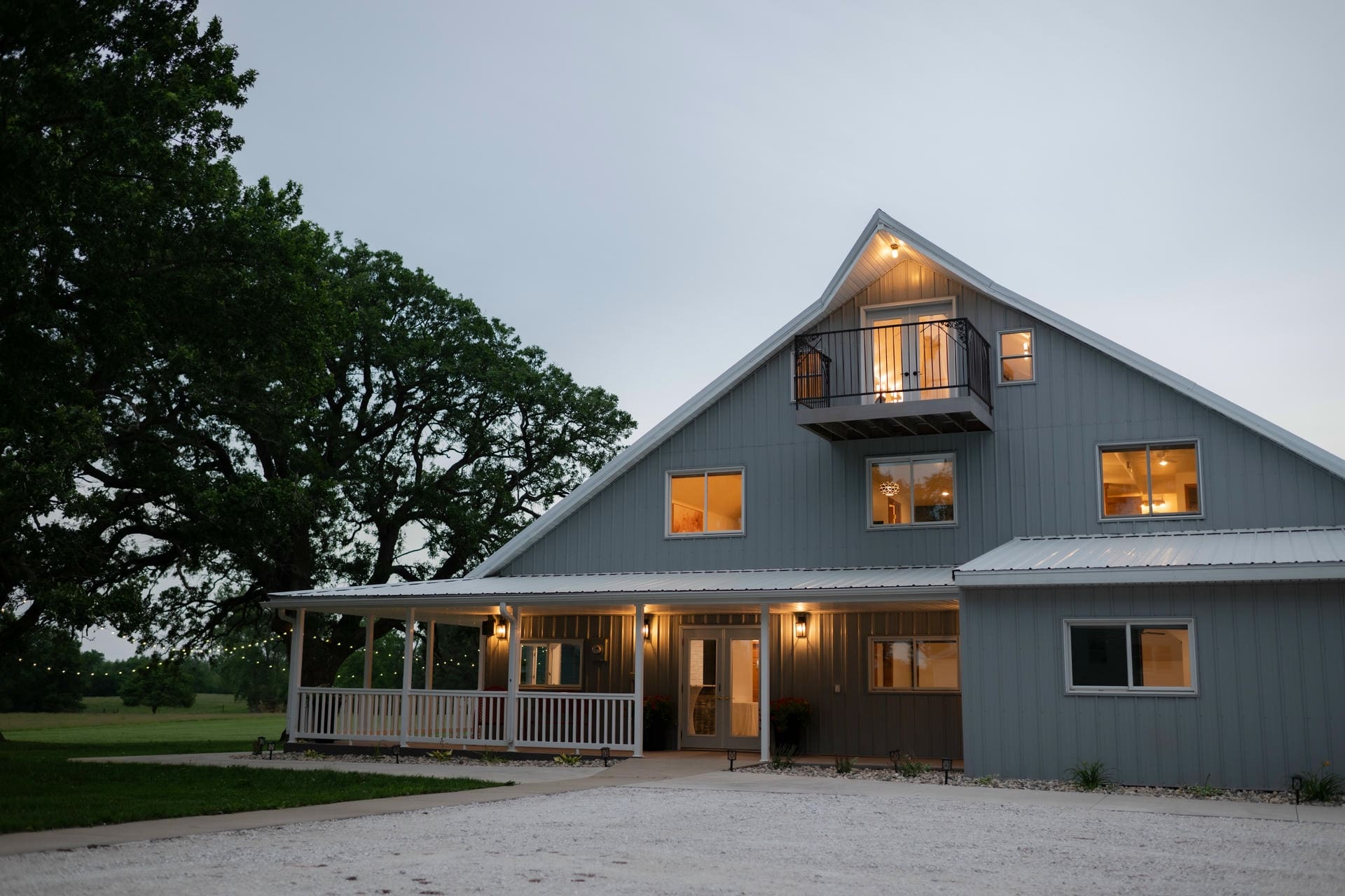 The barn at The Era glowing at dusk — the venue choice at the heart of stress-free wedding planning in the Midwest
