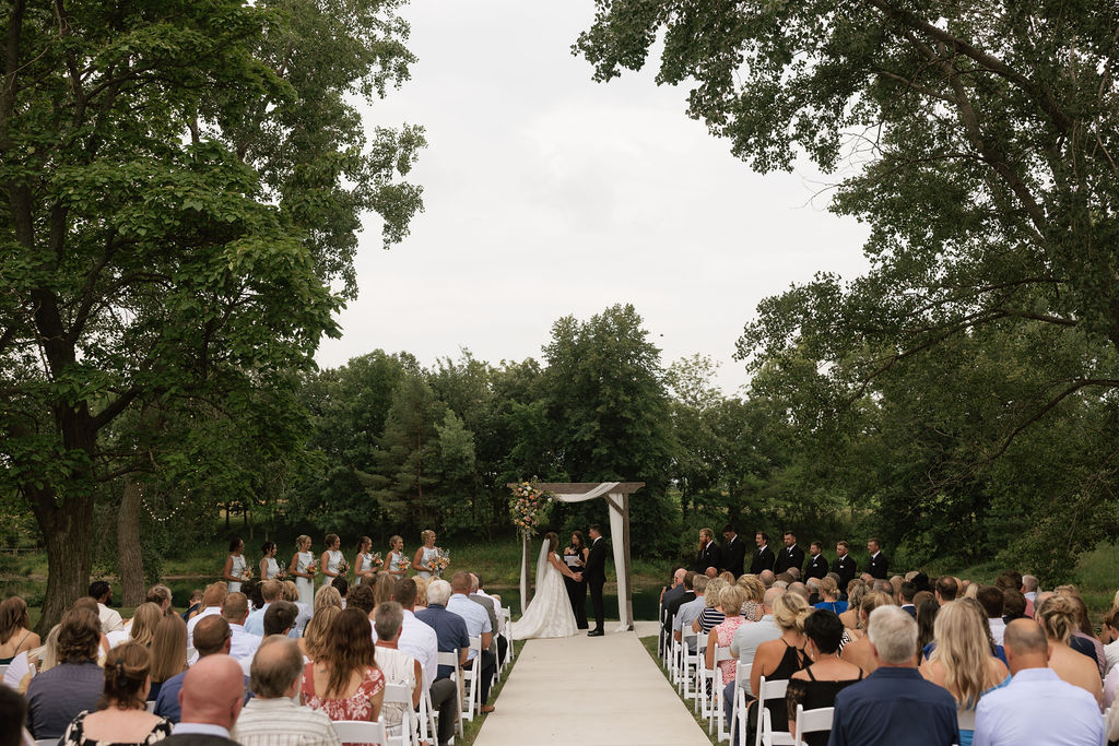 Guests seated in shaded outdoor ceremony space, an example of wedding guest comfort at The Era