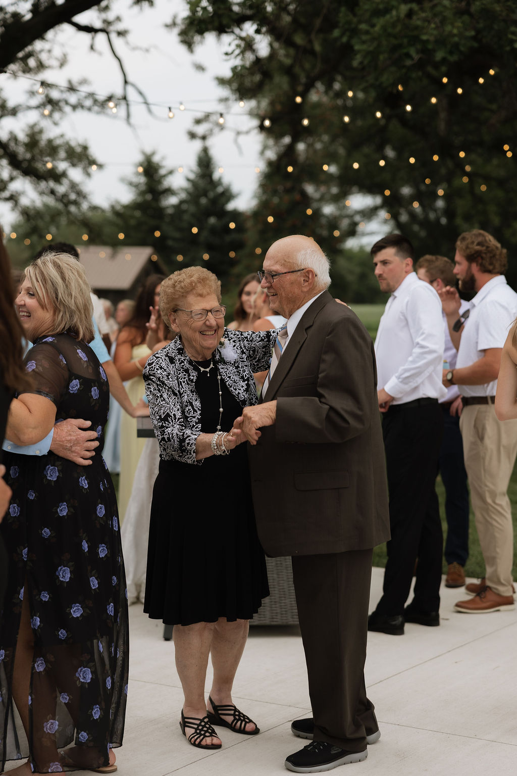Grandparents dancing together at an outdoor wedding reception at The Era