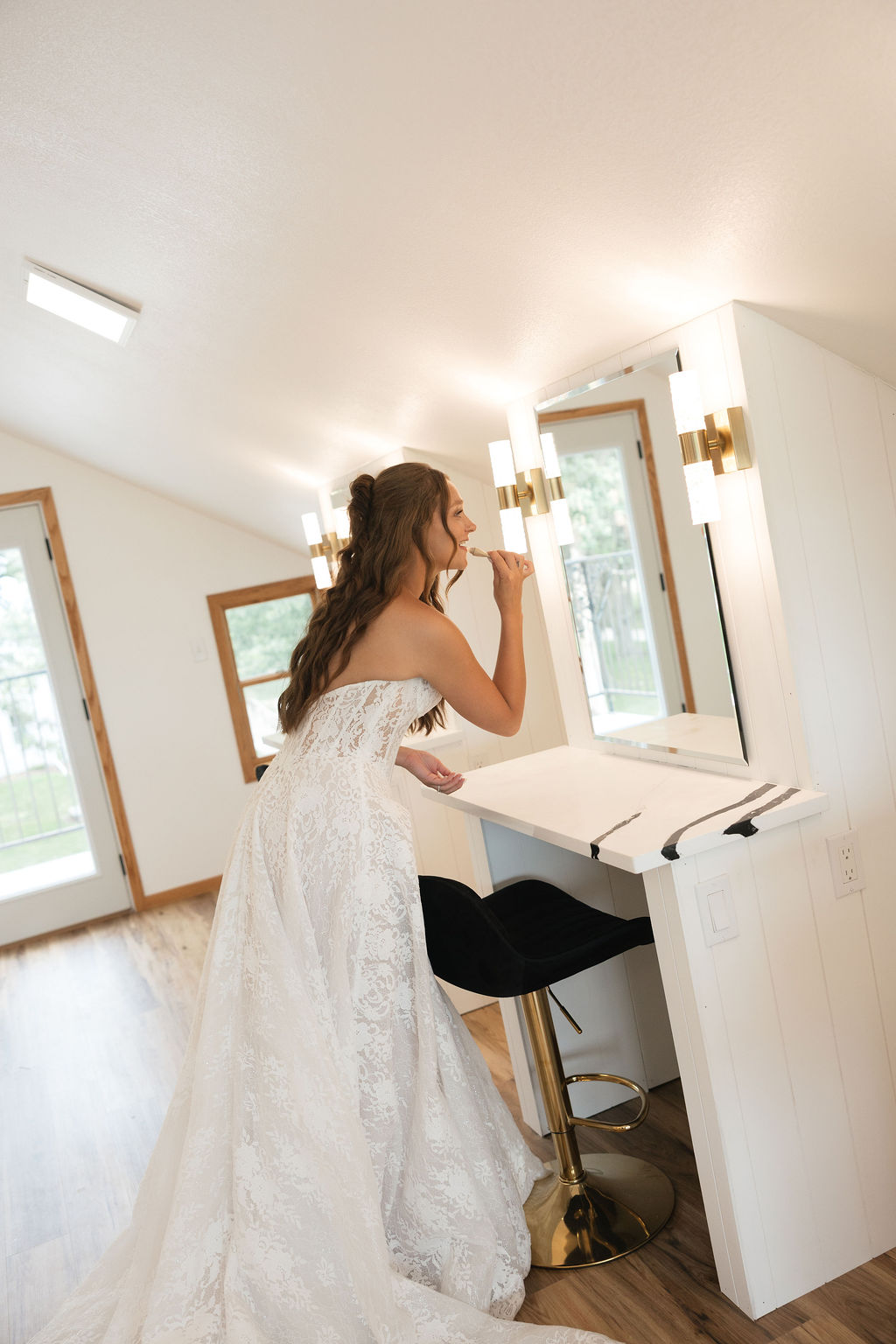 Bride getting ready in the Luxury Bridal Loft at The Era weekend wedding venue